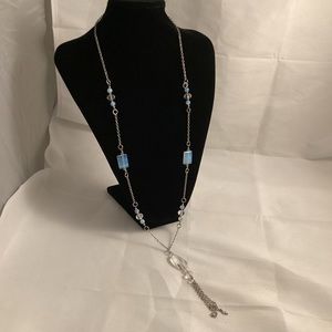 Long silver tone metallic necklace with translucent acrylic beads